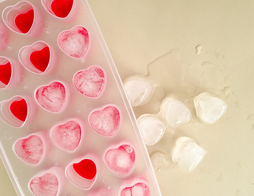 A silicone mold for making heart-shaped decorative ice cubes.